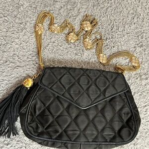 Vintage 1986-1988 satin quilted Chanel handbag with tassel and gold tone strap